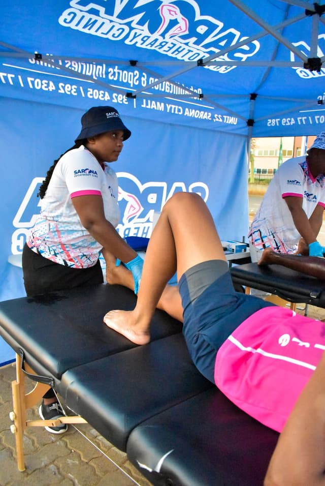 Corporate wellness event with physiotherapy station